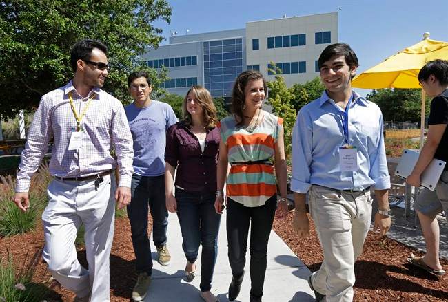 Google interns, from left, Steve Weddler, Alfredo Salinas, Lizzy Burl, Rita DeRaedt, and Alex Rodrigues walk on the Google campus.
