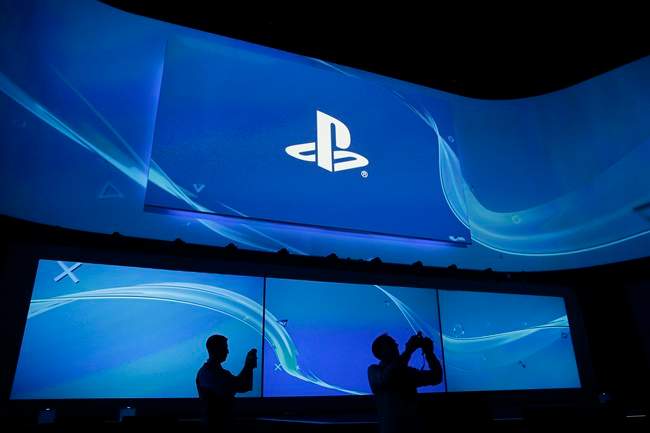 Attendees take pictures at the Sony's Playstation presentation ahead of the Electronic Entertainment Expo on Monday, June 9.