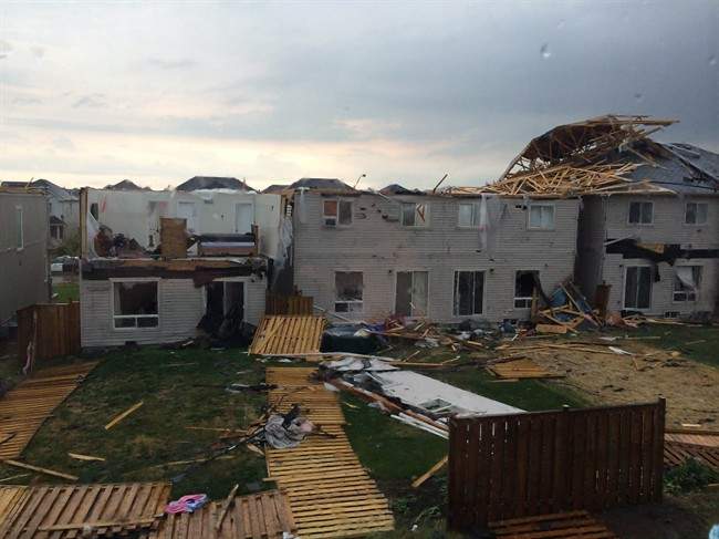 Roofs of homes in Angus, Ontario were ripped off after a tornado on Tuesday June 17, 2014.