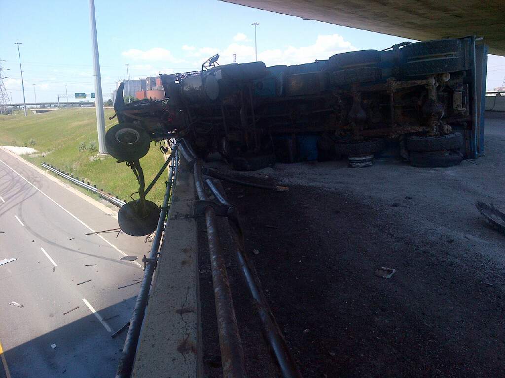 The dump truck spilled gravel and oil across Highway 427