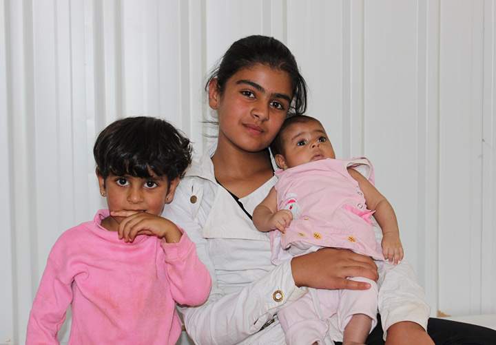 Abir Shahab's children pose for a photo