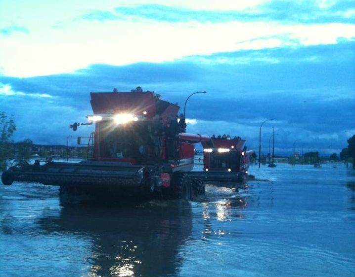 Combines were brought in to help evacuate High River. Courtesy of Shawn Wiebe.