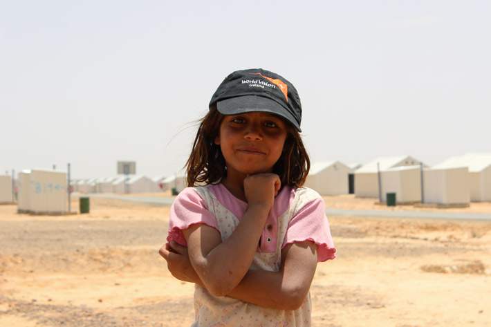 A young Syrian refugee poses in Azraq Camp, Jordan, on May 21, 2014.