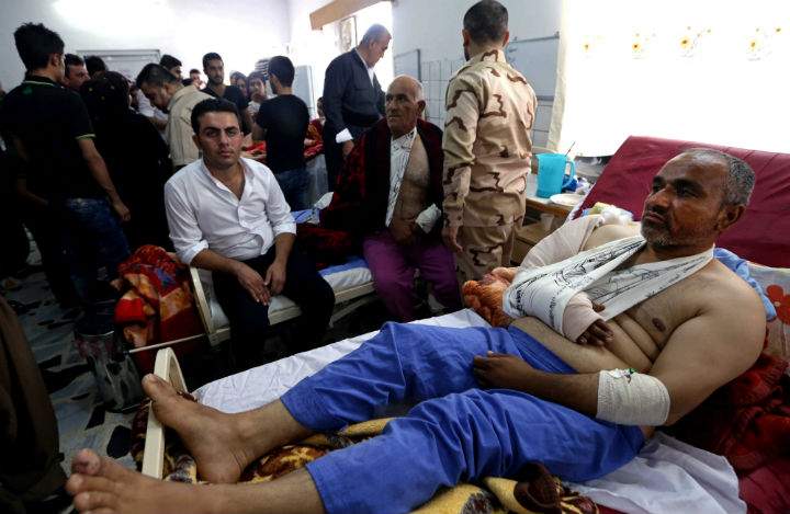 Kurdish peshmerga fighters wounded in fighting with al-Qaida-inspired Sunni militants recover in a hospital bed in Erbill, a city in the Kurdish controlled north 350 kilometers north of Baghdad, Iraq, Wednesday, June 18, 2014. Kurdish security and hospital officials said Wednesday that fighting has been raging since morning between Kurdish fighters known as peshmerga and militants who are trying to take the town of Jalula, in the restive Diyala province some 125 kilometers northeast of Baghdad.