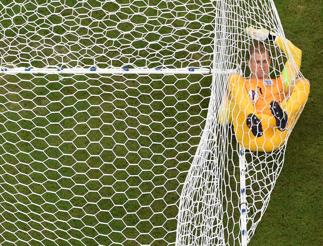 England's goalkeeper Joe Hart lies in the net after Italy's forward Mario Balotelli (not pictured) scored during a Group D football match between England and Italy at the Amazonia Arena in Manaus during the 2014 FIFA World Cup on June 14, 2014. POOL AFP PHOTO / FRANCOIS XAVIER MARIT (Photo credit should read FRANCOIS XAVIER MARIT/AFP/Getty Images)
