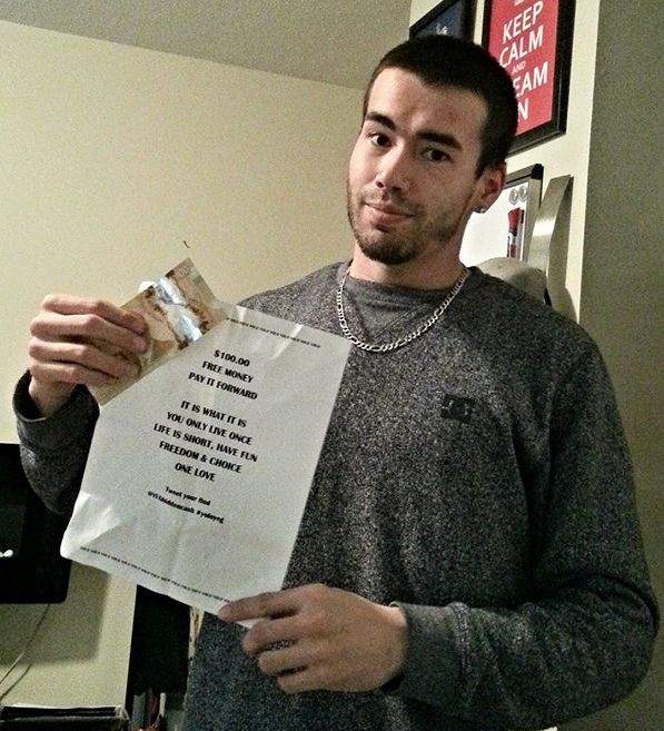 Jody Mitoma with the $100 he found taped to a pole in Edmonton Thursday morning.
