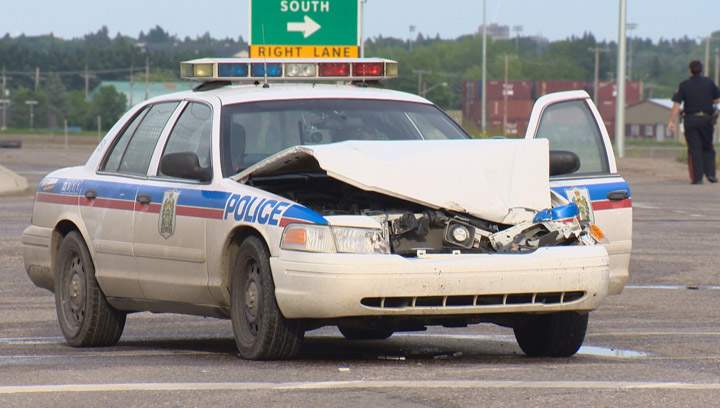 Driver arrested after stolen truck rams Saskatoon police cruiser, collides with several vehicles during afternoon rush hour.