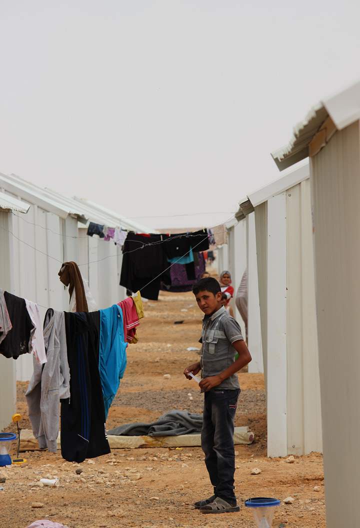 Laundry hangs to dry between shelters in Azraq Camp