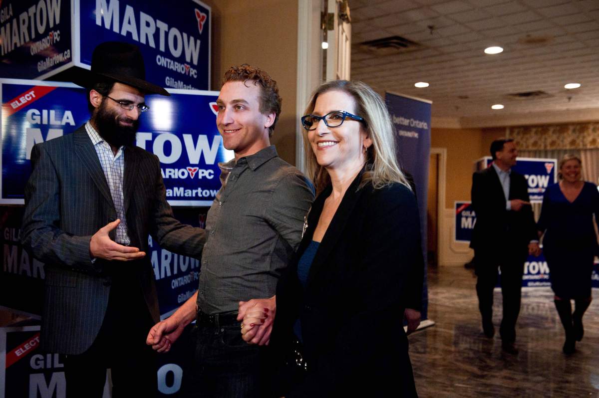 Ontario PC candidate for Thornhill Gila Martow celebrates a victory in the Thornhill by-election with her son Evan, right, onThursday night, February 13, 2014.