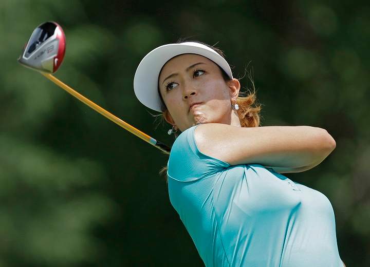 Michelle Wie watches her tee shot on the seventh hole during the final round of the U.S. Women's Open golf tournament in Pinehurst, N.C., Sunday, June 22, 2014. 