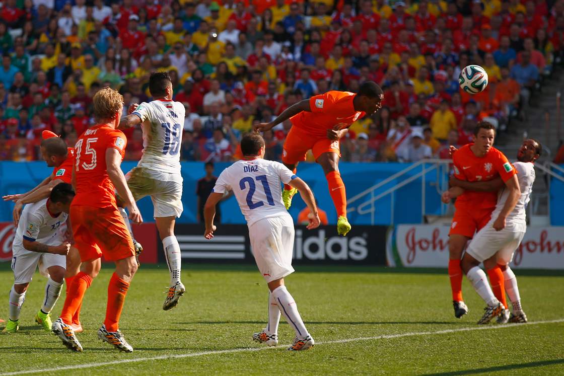 SAO PAULO, BRAZIL - JUNE 23: Leroy Fer of the Netherlands scores his team's first goal on a header during the 2014 FIFA World Cup Brazil Group B match between the Netherlands and Chile at Arena de Sao Paulo on June 23, 2014 in Sao Paulo, Brazil. (Photo by Clive Rose/Getty Images)