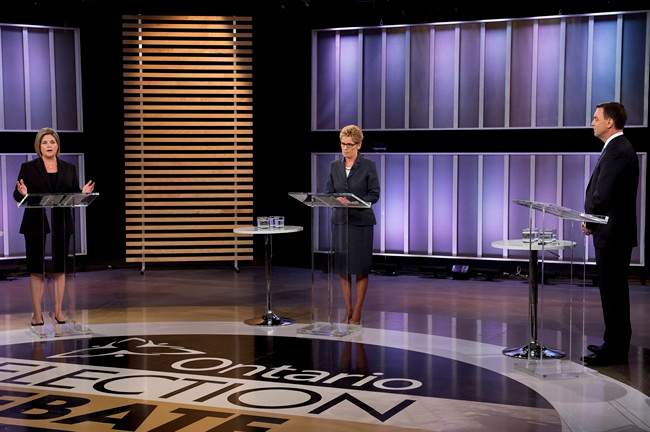 Ontario NDP leader Andrea Horwath, left, Ontario Premier Kathleen Wynne, centre, and Ontario PC leader Tim Hudak, right, take part in the live leaders debate at CBC during the Ontario election in Toronto on Tuesday, June 3, 2014. THE CANADIAN PRESS/Frank Gunn.