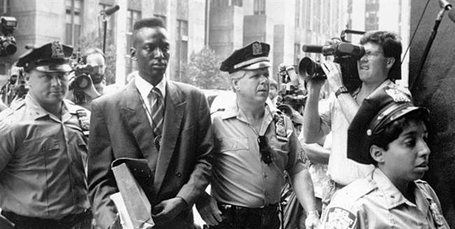 This 1990 file photo provided by Sundance Selects shows accused rapist Yusef Salaam, second right, being escorted by police in New York in 1990. (AP Photo/Sundance Selects, NY Daily News, File).