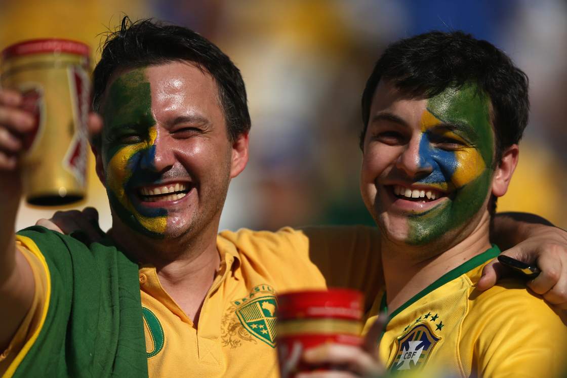 SAO PAULO, BRAZIL - JUNE 12: Brazil fans enjoy the atmosphere before the Opening Ceremony of the 2014 FIFA World Cup Brazil prior to the Group A match between Brazil and Croatia at Arena de Sao Paulo on June 12, 2014 in Sao Paulo, Brazil. (Photo by Warren Little/Getty Images)