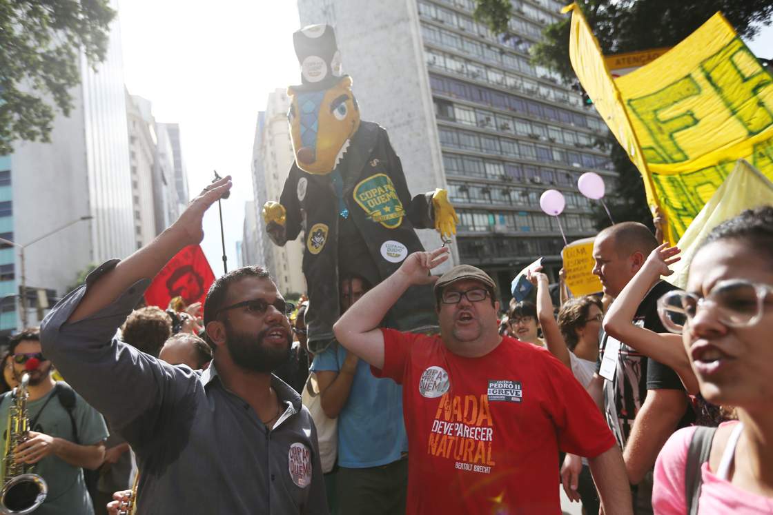 RIO DE JANEIRO, BRAZIL - JUNE 12: Protestors rally during an anti- World Cup demonstration on June 12, 2014 in Rio de Janeiro, Brazil. This is the first day of World Cup play. (Photo by Joe Raedle/Getty Images)