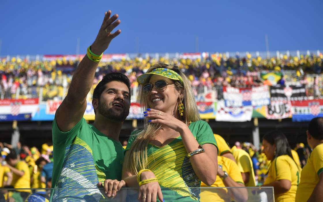 Brazilian fans attend the Group A football match between Brazil and Croatia at the Corinthians Arena in Sao Paulo during the 2014 FIFA World Cup on June 12, 2014. AFP PHOTO / FABRICE COFFRINI (Photo credit should read FABRICE COFFRINI/AFP/Getty Images)