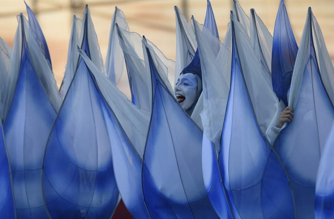 Performers take part in the opening ceremony of the 2014 FIFA football World Cup at the Corinthians Arena in Sao Paulo on June 12, 2014. AFP PHOTO / DIMITAR DILKOFF (Photo credit should read DIMITAR DILKOFF/AFP/Getty Images)