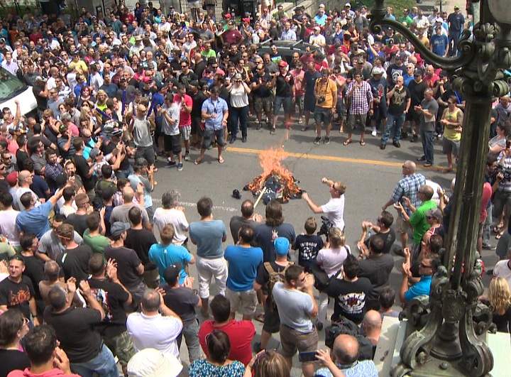 Hundreds of city workers in Montreal participated in protests with firefighters lighting hats on fire to show their frustration with proposed pension reforms on June 17, 2014.