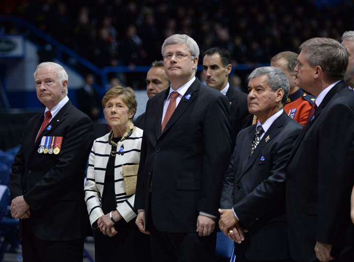 Governor General David Johnston (left to right) and wife Sharon, Prime Minister Stephen Harper, N.B. Lt. Gov. Graydon Nicholas and N.B. Premier David Alward wait for the start of the RCMP regimental funeral on Tuesday, June 10, 2014 for the three RCMP officers who were gunned down in Moncton last week.