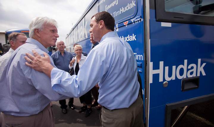 Ontario PC leader Tim Hudak, right, says goodbye to Chatham-Kent-Essex PC candidate Rick Nicholls following a campaign stop at J.B. Coatings in Chatham Ontario, Tuesday, September 13, 2011.
