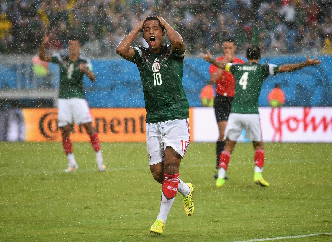 Mexican forward Giovani dos Santos reacts after his goal was disallowed due to an offside call.