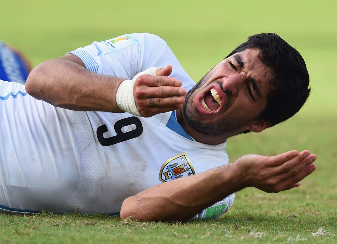Luis Suarez of Uruguay reacts during the 2014 FIFA World Cup Brazil Group D match between Italy and Uruguay at Estadio das Dunas on June 24, 2014 in Natal, Brazil. (Photo by Matthias Hangst/Getty Images)