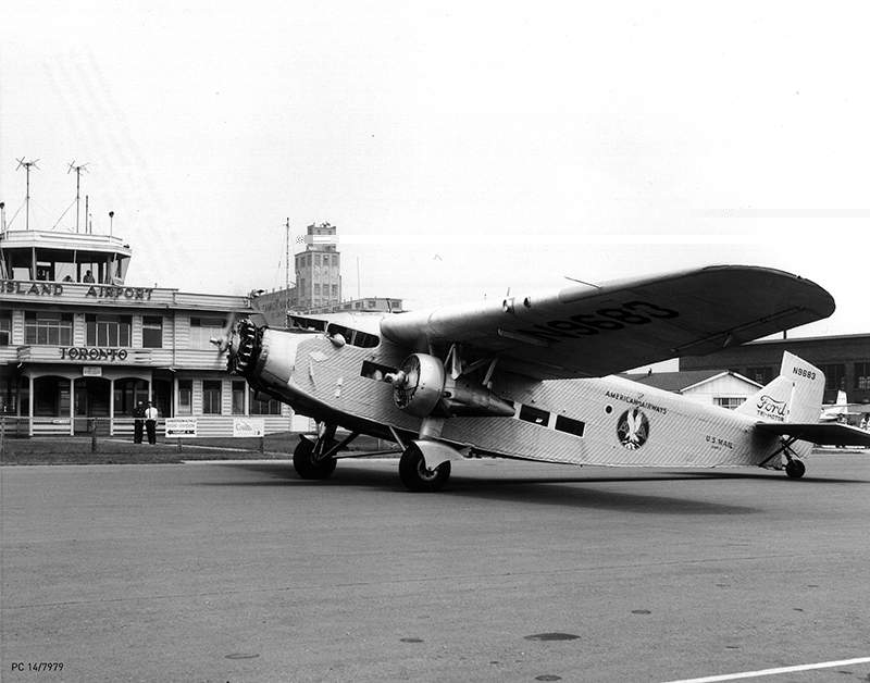 July 1, 1964: American Airways U.S. Mail Plane-Vintage Ford Tri-motor warms up its engines in front of the Island Airport Terminal Building (Terminal A).
