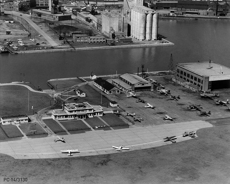 May 24, 1957: Aerial view of the Island Airport and Terminal Building, and established “Island Tower” equipped with a radio.