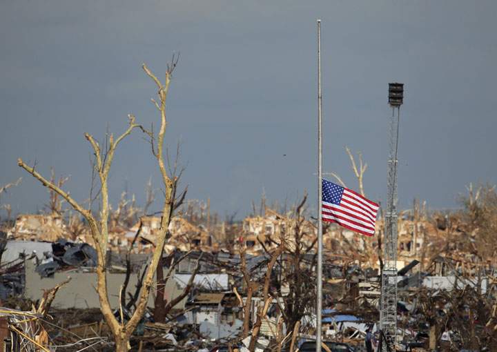 A portable tornado siren sits among the ruins of Joplin, Mo. staff after a deadly tornado struck in 2011.