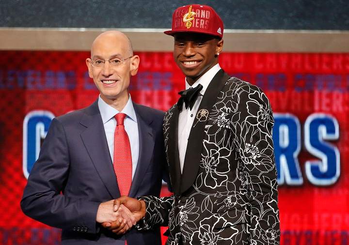 NBA Commissioner Adam Silver, left, congratulates Andrew Wiggins who was selected by the Cleveland Cavaliers as the number one pick in the 2014 NBA draft, Thursday, June 26, 2014, in New York.