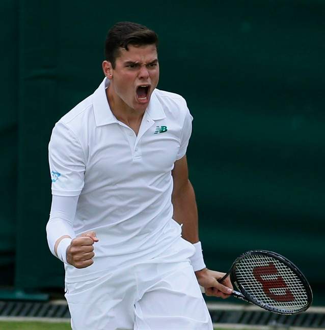 Milos Raonic of Canada celebrates after defeating Lukasz Kubot of Poland during their men's singles match at the All England Lawn Tennis Championships in Wimbledon, London, Saturday, June 28, 2014. (AP Photo/Alastair Grant).