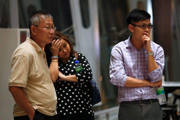 People react as they wait for news.