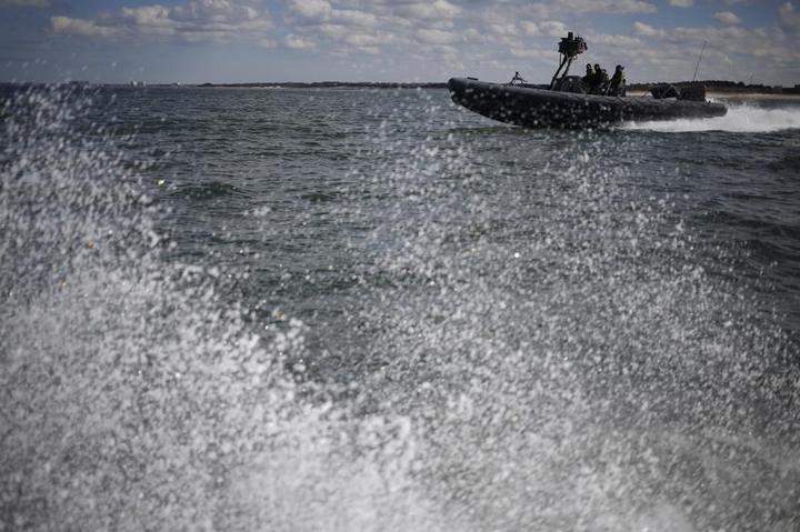 A Rigid Hull Inflatable Boat, or RHIB, operates on the Chesapeake Bay off the coast of Virginia Beach, Va. during a coxswain training mission on February 27, 2013.