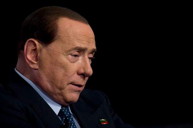 In this file photo taken in Rome on May 21, 2014, former Italian Premier and Forza Italia (Go Italy) party leader Silvio Berlusconi talks during the recording of a tv-talk show.  (AP Photo/Andrew Medichini).