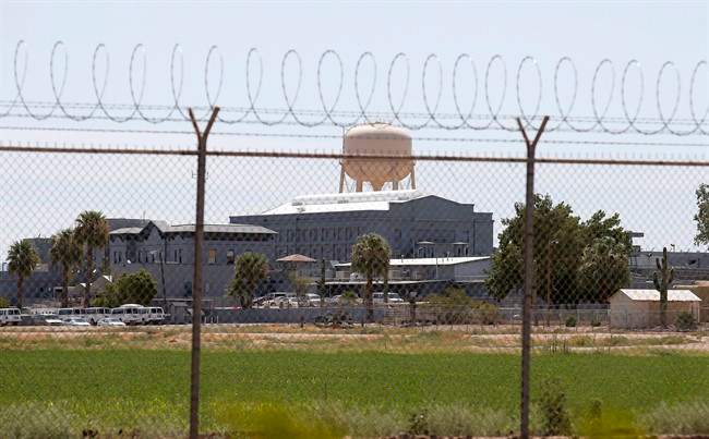 A fence surrounds the state prison in Florence, Ariz. where the execution of Joseph Rudolph Wood took place on Wednesday, July 23, 2014. 