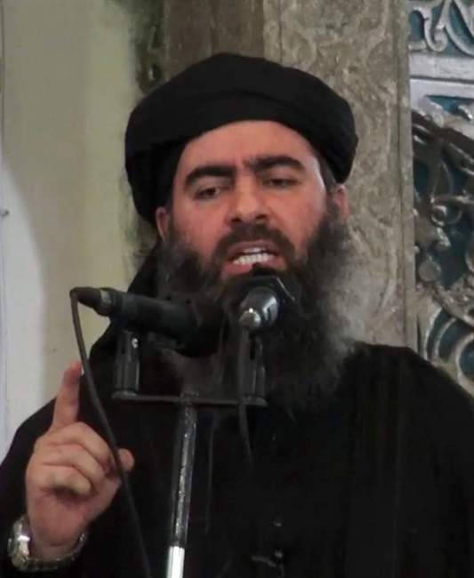This image made from video posted on a militant website Saturday, July 5, 2014, which has been authenticated based on its contents and other AP reporting, purports to show the leader of the Islamic State group, Abu Bakr al-Baghdadi, delivering a sermon at a mosque in Iraq.