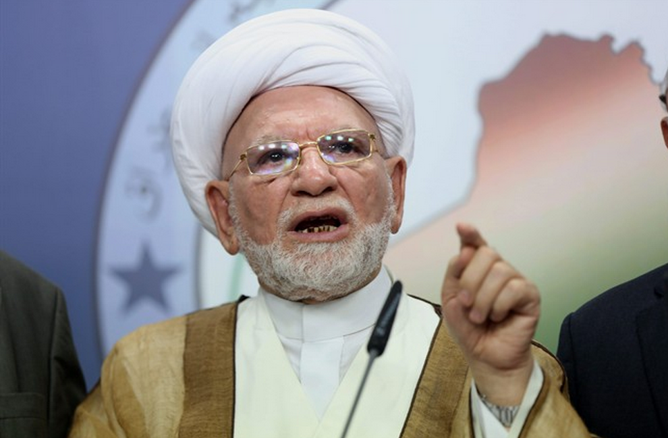 Shiite lawmaker Mohammad Taqi al-Mawla speaks to the media in Baghdad, Iraq, Wednesday, July 23, 2014. Iraq's parliament convened to vote for a new president on Wednesday. (AP Photo/Karim Kadim).
