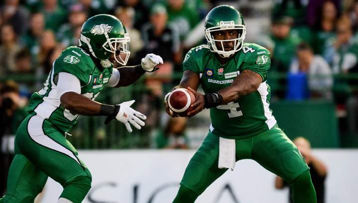 Saskatchewan Roughriders quarterback Darian Durant passes the ball to Saskatchewan Roughriders running back Will Ford during the first quarter of CFL football action against the Toronto Argonauts in Regina, Sask., Saturday, July 26, 2014.