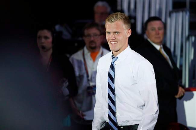 Nikolaj Ehlers walks to the stage after being chosen ninth overall by the Winnipeg Jets during the first round of the NHL hockey draft in June.