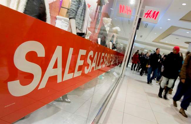 Shoppers walk in a mall in Ottawa on Thursday, Dec. 26, 2013. THE CANADIAN PRESS/Justin Tang