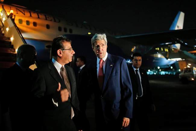 Secretary of State John Kerry is greeted by Egypt's Minister of Foreign Affairs protocol chief Nabil Habashi as Kerry arrives in Cairo, Egypt, Monday, July 21, 2014. Kerry has returned to the Middle East as the Obama administration attempts to bolster regional efforts to reach a cease fire and sharpens its criticism of Hamas in its conflict with Israel. (AP Photo/Charles Dharapak, Pool).