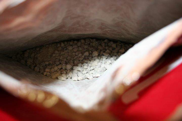 A 26-year-old woman has been charged after 2.82 kilograms of heroin was seized at EIA in May.