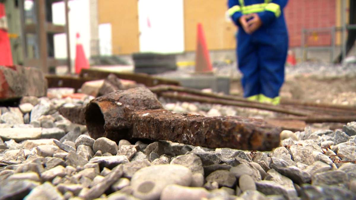 Enmax employees found artifacts related to the building and maintenance of the Canadian Pacific rail line buried under dirt and gravel.