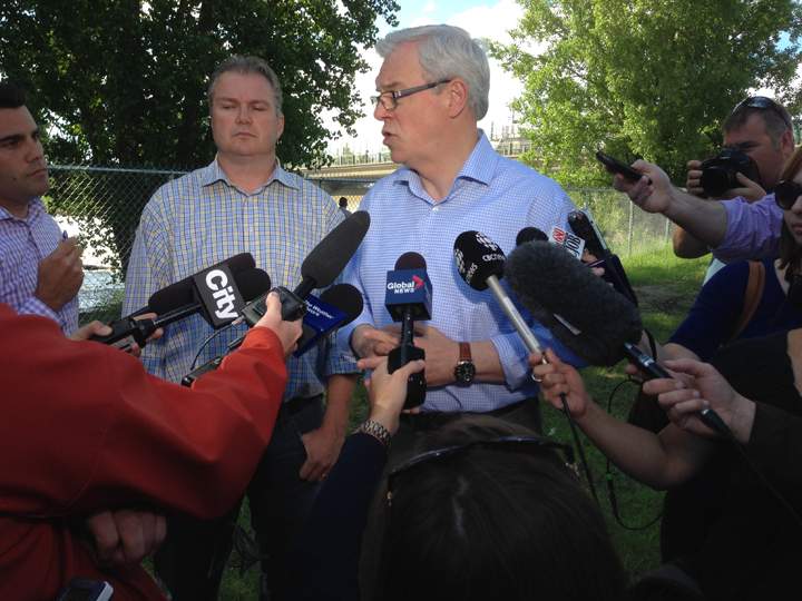 Premier Greg Selinger speaks to the media at Spillway Park near the Portage Diversion control structure on Wednesday.