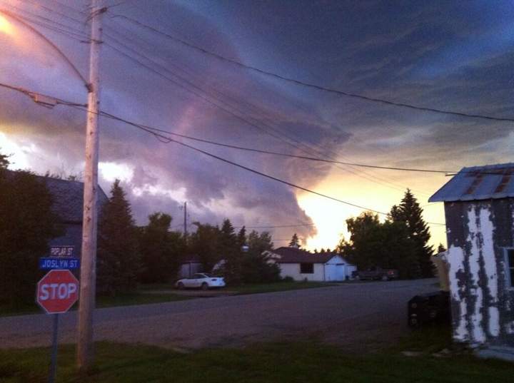 The storm threatens Hartney, Man., on Saturday. A tornado touched down nearby.