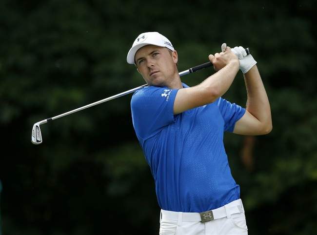 Jordan Spieth watches his drive on the 12th tee during the first round of the 2014 John Deere Classic golf tournament at TPC Deere Run in Silvis, Ill., Thursday, July 10, 2014. (AP Photo/Charles Rex Arbogast)