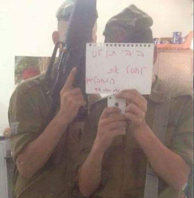 Israeli Defense Force members hold a sign reading “Bibi, let us assassinate the terrorists” in a photo posted to a Facebook group.