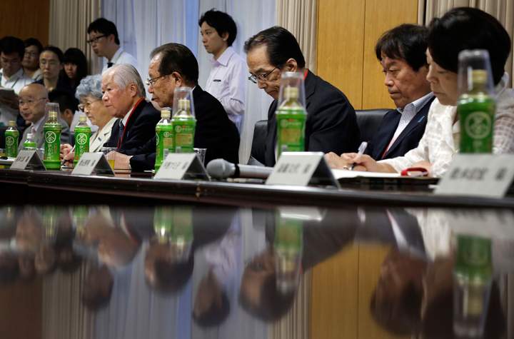 The Japanese abductees’ family members, seated from left to right., Masaru Honma, Sakie Yokota, Shigeru Yokota, Shigeo Izuka, Shichirou Hamamoto Teruaki Masumoto and Fumiko Hirano bow slightly as Japan’s Abduction Issue Minister Keiji Furuya, not in picture, speaks prior to a briefing in Tokyo, Friday, July 4, 2014.
