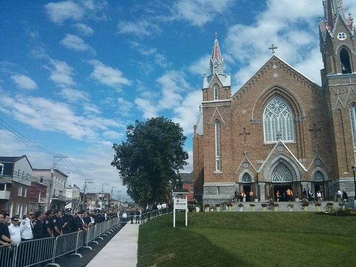 Firefighters from all over the province, and as far away as Maine, gather for a memorial mass in Lac-Megantic on July 6, 2014.