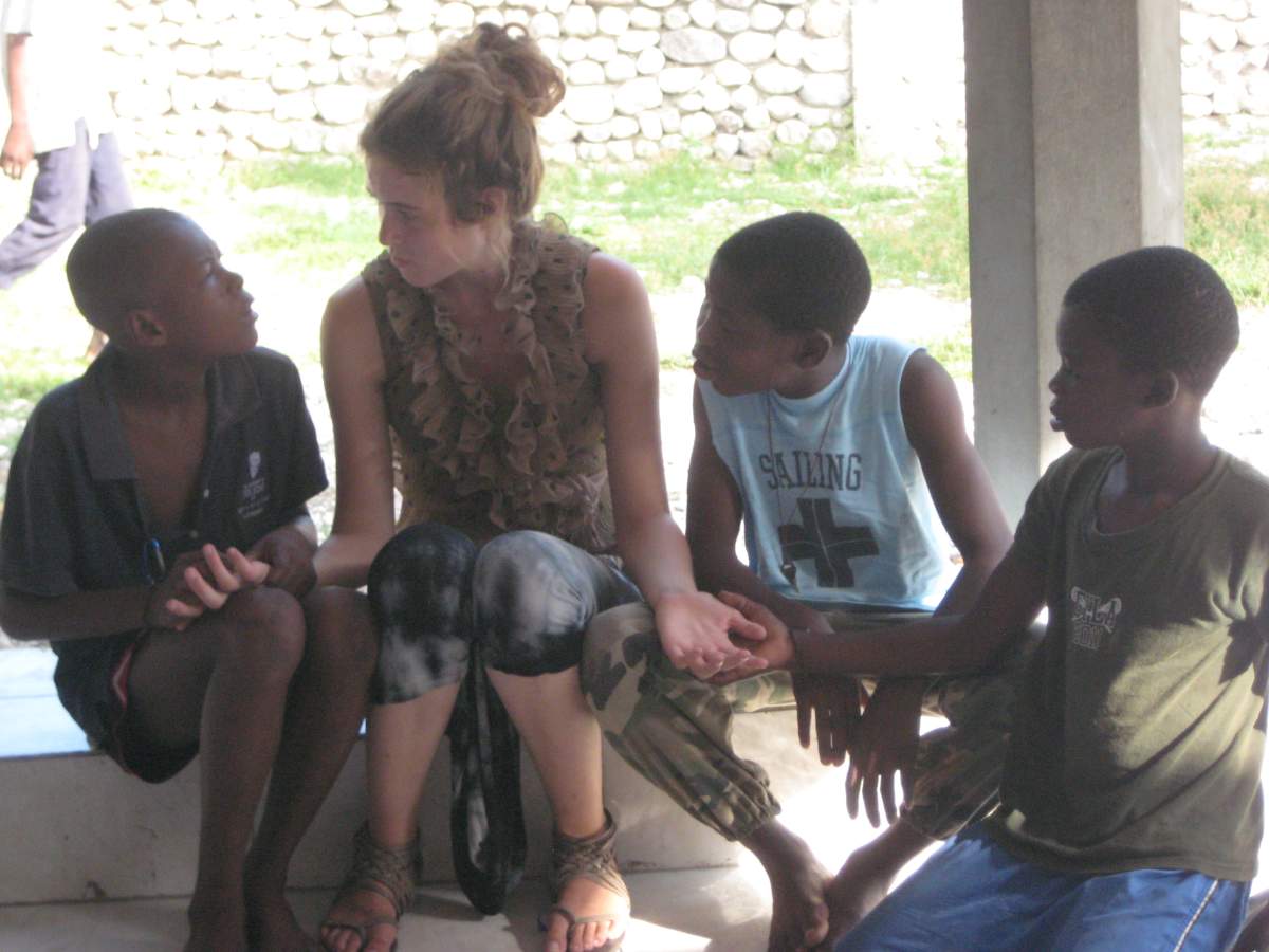 Morgan and children at the Les Cayes transitional safe house. (2013).